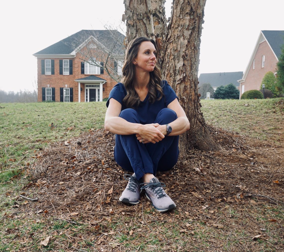 physical therapist sitting under tree