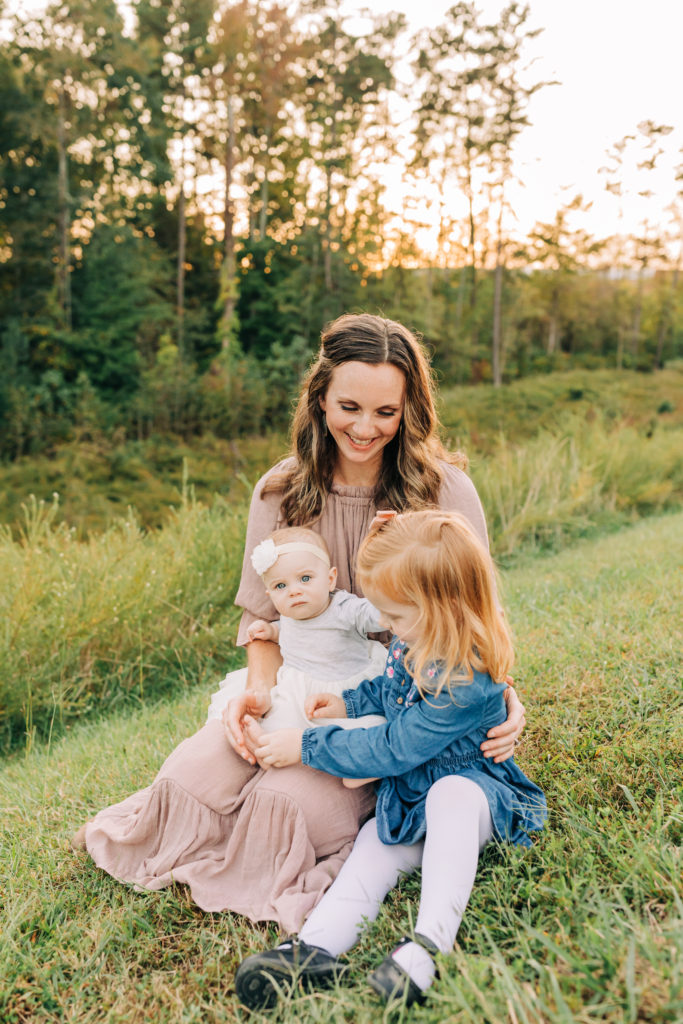 Mother sitting with two daughters