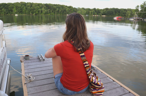 woman sitting on dock