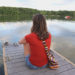 woman sitting on dock