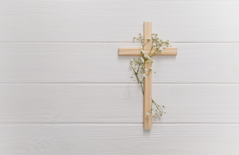 Cross with flowers on wall